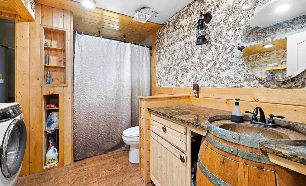 Rustic bathroom renovation with stone accents